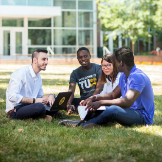 Towson University student operating media equipment