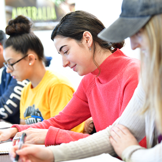 Towson University student operating media equipment